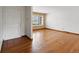 Bright and airy living room featuring gleaming hardwood floors and a neutral color palette at 2433 S Oneida St, Denver, CO 80224