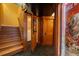 Finished basement with adjacent stairs, decorative carpet, and movie poster art at 445 Madison N St, Denver, CO 80206