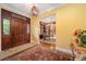 Welcoming foyer featuring wood floors, elegant lighting, and an adjacent home office at 445 Madison N St, Denver, CO 80206