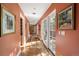 Hallway with hardwood floors and access to a private balcony at 445 Madison N St, Denver, CO 80206