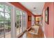 Hallway features hardwood floors, recessed lighting, doors to the balcony, and artwork at 445 Madison N St, Denver, CO 80206