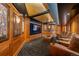 Home theater features leather recliners, paneled walls, and custom carpeting at 445 Madison N St, Denver, CO 80206