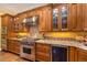 Chef's kitchen features custom wood cabinets, granite countertops, Wolf range and stainless steel appliances at 445 Madison N St, Denver, CO 80206