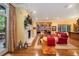 Bright living room with fireplace, bookcase, hardwood floors and large windows at 445 Madison N St, Denver, CO 80206