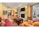 Comfortable living room features a fireplace, hardwood floors, and a view of the patio at 445 Madison N St, Denver, CO 80206