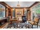 Comfortable home office featuring wood floors, custom built-ins, and an outside view at 445 Madison N St, Denver, CO 80206