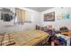 This bedroom with a comfortable bed and lots of items, needs a good cleaning and organizing at 6933 W 52Nd Pl, Arvada, CO 80002