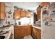 Functional kitchen features wooden cabinetry and vintage appliances at 6933 W 52Nd Pl, Arvada, CO 80002