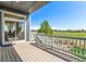 Exterior view from the deck overlooking the yard and green fields at 15122 Uinta St, Thornton, CO 80602