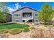 Charming backyard featuring lush green lawn, manicured landscaping, and a cozy outdoor space at 15122 Uinta St, Thornton, CO 80602