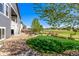 Beautifully landscaped backyard with lush lawn, mature trees, and a tranquil setting at 15122 Uinta St, Thornton, CO 80602