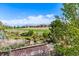 Inviting backyard with mature landscaping offering stunning views of the adjacent green golf course at 15122 Uinta St, Thornton, CO 80602