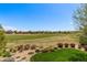 Expansive backyard with lush lawn and beautiful landscaping overlooking a green golf course at 15122 Uinta St, Thornton, CO 80602