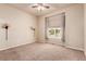 Bright bedroom featuring a ceiling fan, neutral walls, and a window with blinds at 15122 Uinta St, Thornton, CO 80602