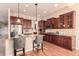 Well-equipped kitchen with granite countertops, stainless steel appliances, and pendant lighting over the breakfast bar at 15122 Uinta St, Thornton, CO 80602