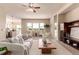 Bright living room featuring large windows and modern furnishings creating a comfortable and inviting atmosphere at 15122 Uinta St, Thornton, CO 80602