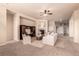 Spacious living room with a fireplace, neutral decor, and plush carpeting, creating a cozy atmosphere at 15122 Uinta St, Thornton, CO 80602