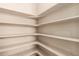 Spacious pantry with ample shelving for organized storage of groceries and household items at 15122 Uinta St, Thornton, CO 80602