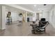 Spacious finished basement with bar area, lounge seating, and hardwood floors at 6991 S Lee Way, Littleton, CO 80127