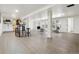 Large, finished basement featuring a bar area, ample seating, and multiple access points at 6991 S Lee Way, Littleton, CO 80127