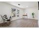 Bright room with laminate flooring and a view of the trees at 6991 S Lee Way, Littleton, CO 80127
