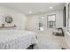 A spacious bedroom with neutral colors, modern decor, and cozy furnishings at 6991 S Lee Way, Littleton, CO 80127