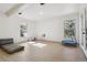 Spacious bonus room with hardwood flooring and natural light from the windows at 6991 S Lee Way, Littleton, CO 80127