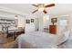 Bright bedroom with a mirrored closet, queen bed and neutral-colored walls at 10596 Ura Ln, Northglenn, CO 80234