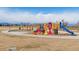 Playground featuring colorful play structures with swings and slides and mountain backdrop at 10596 Ura Ln, Northglenn, CO 80234