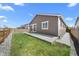 Private backyard with a well-maintained lawn and a concrete patio, perfect for entertaining at 55 S Edge Cliff St, Castle Rock, CO 80104