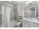 Well-lit bathroom with tub-shower combo, storage cabinet, and modern vanity at 55 S Edge Cliff St, Castle Rock, CO 80104