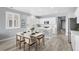 This eat-in kitchen offers an island and dining area with views into an open-concept kitchen and living space at 55 S Edge Cliff St, Castle Rock, CO 80104