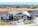 Charming single-Gathering home featuring a well-manicured lawn, a two-car garage, and beautiful mountain views in the background at 55 S Edge Cliff St, Castle Rock, CO 80104