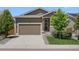 Charming single-Gathering home featuring a well-maintained lawn, a two-car garage, and a welcoming front porch at 55 S Edge Cliff St, Castle Rock, CO 80104
