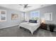 Serene main bedroom with a ceiling fan, soft gray walls, and plenty of natural light at 55 S Edge Cliff St, Castle Rock, CO 80104