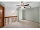 Carpeted upstairs room features a ceiling fan and a nearby skylight at 8753 W Cornell Ave # 12-1, Denver, CO 80227