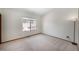 Spacious bedroom with carpet, natural light from the window, and corner lighting at 8753 W Cornell Ave # 12-1, Denver, CO 80227