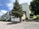 Exterior view shows townhome complex with visitor parking, landscaping, and multi-level design at 8753 W Cornell Ave # 12-1, Denver, CO 80227