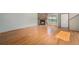 Warm living room with a stone fireplace and light-filled windows on hardwood floors at 8753 W Cornell Ave # 12-1, Denver, CO 80227