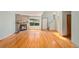 Spacious living room with hardwood floors, stone fireplace, and ample natural light at 8753 W Cornell Ave # 12-1, Denver, CO 80227