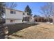 Spacious backyard with a large deck and an outdoor structure that may be used for a barbecue or dining at 1655 S Quintero Way, Aurora, CO 80017