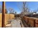 Fenced backyard features a patio area, rocks, and a table with chairs at 1655 S Quintero Way, Aurora, CO 80017