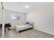 Well-lit bedroom with a single bed, neutral colors, and modern decor at 1655 S Quintero Way, Aurora, CO 80017