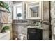 Small bathroom with tiled walls and a modern sink at 6721 Birch St, Commerce City, CO 80022