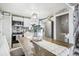 Modern kitchen with stainless steel appliances and white cabinets at 6721 Birch St, Commerce City, CO 80022