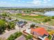 Aerial view of a property with a baseball field, lake, and neighborhood in the distance at 3595 W 67Th S Ave, Denver, CO 80221