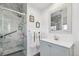 Bathroom showcasing glass shower, stylish vanity and decorative framed mirror at 3595 W 67Th S Ave, Denver, CO 80221