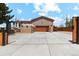 Inviting home with a modern garage door, gated driveway, and charming curb appeal at 3595 W 67Th S Ave, Denver, CO 80221