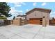 Inviting home with a modern garage door, gated driveway, and charming curb appeal at 3595 W 67Th S Ave, Denver, CO 80221