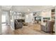 Spacious living room with a fireplace, plush seating, and natural light at 3595 W 67Th S Ave, Denver, CO 80221